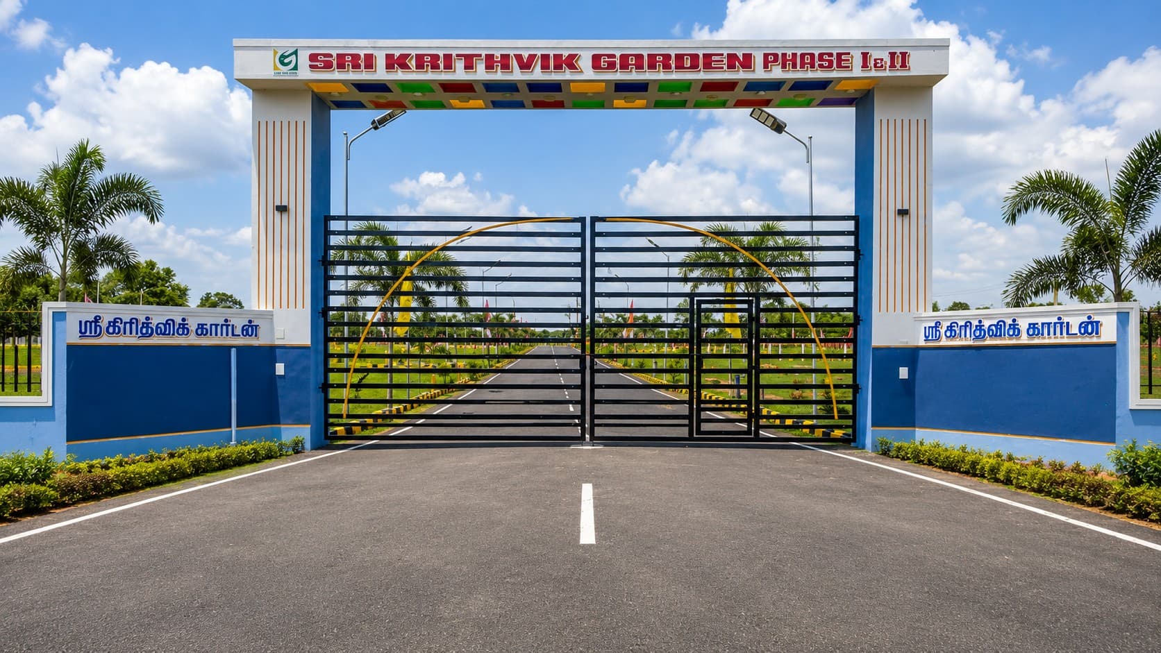 Entrance arch of the Sri Krithvik Garden plotted layout in Arakkonam, with the project name and a paved approach road